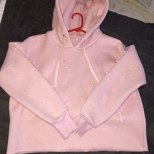 I am selling a light pink cropped sweatshirt